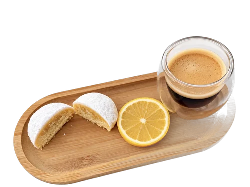 Fondant au citron coupé en deux, cœur moelleux sous l'enrobage de noix de coco